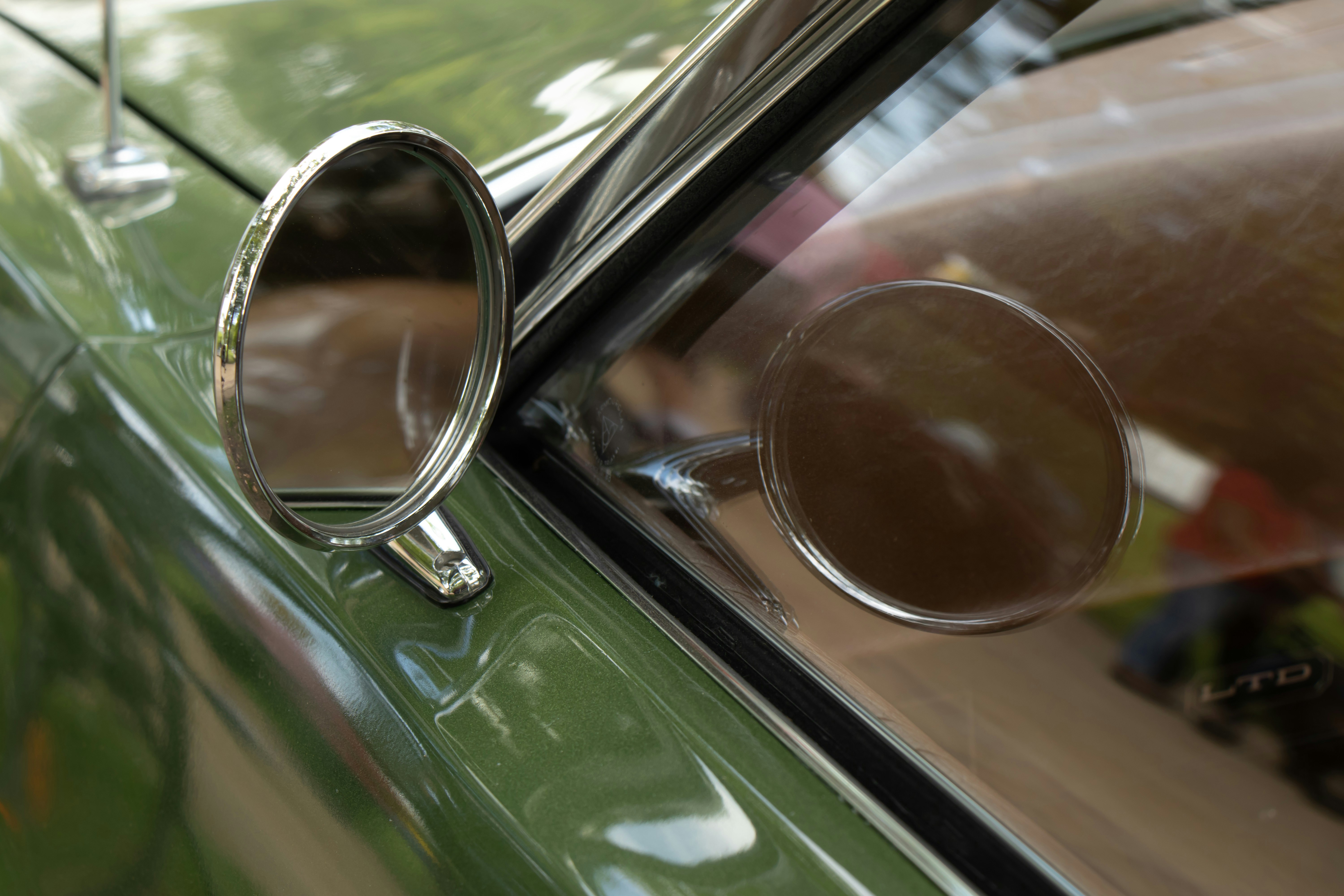 Luxury vintage car detail with chrome mirrors